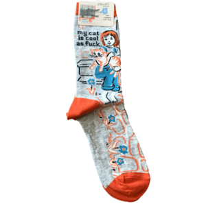 grey and orange socks with image of girl holding cat "my cat is cool as fuck"