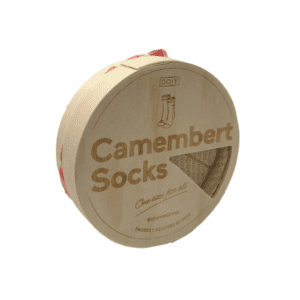 Beige socks folded to look like a wheel of camembert cheese in a wooden box.