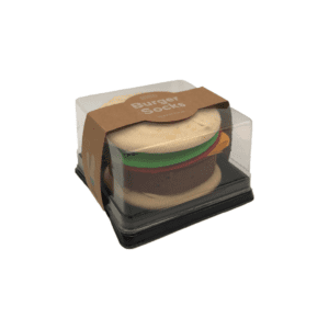 A pair of socks folded to look like a burger in a plastic box.
