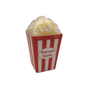 A pair of yellow socks packaged in a movie theatre popcorn box